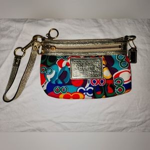 Women's Coach multicolored/gold wristlet.